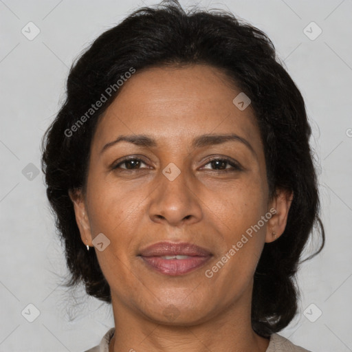 Joyful black adult female with medium  brown hair and brown eyes