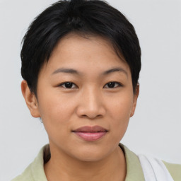 Joyful asian young-adult female with short  brown hair and brown eyes