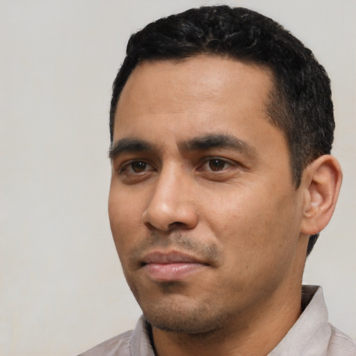 Neutral latino young-adult male with short  black hair and brown eyes