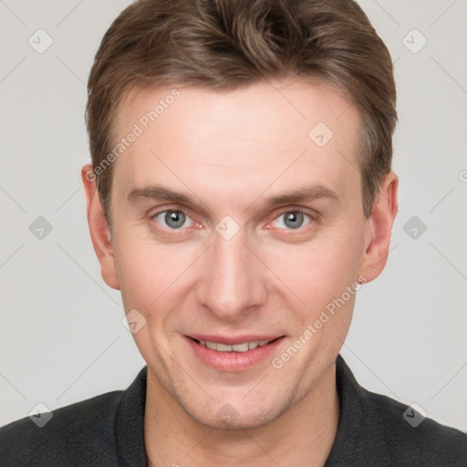 Joyful white adult male with short  brown hair and grey eyes