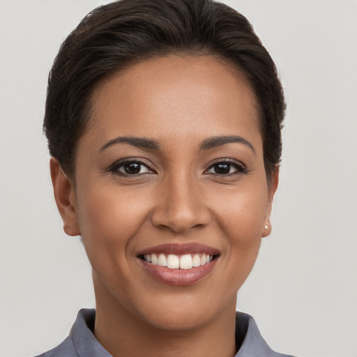 Joyful white young-adult female with short  brown hair and brown eyes