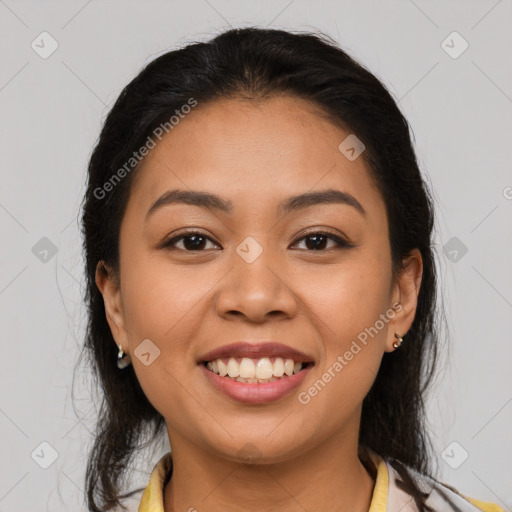 Joyful latino young-adult female with medium  brown hair and brown eyes