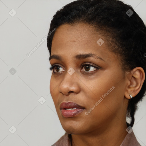 Neutral black young-adult female with short  black hair and brown eyes