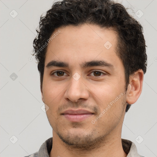 Joyful white young-adult male with short  black hair and brown eyes