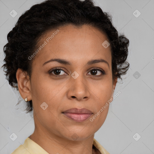 Joyful latino adult female with short  brown hair and brown eyes