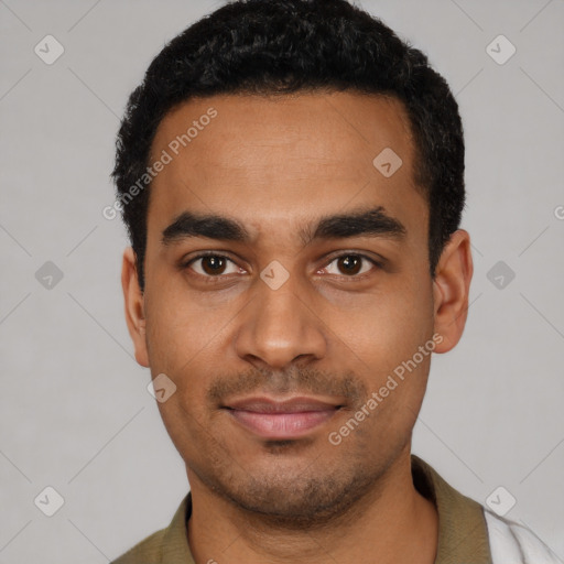 Joyful latino young-adult male with short  black hair and brown eyes