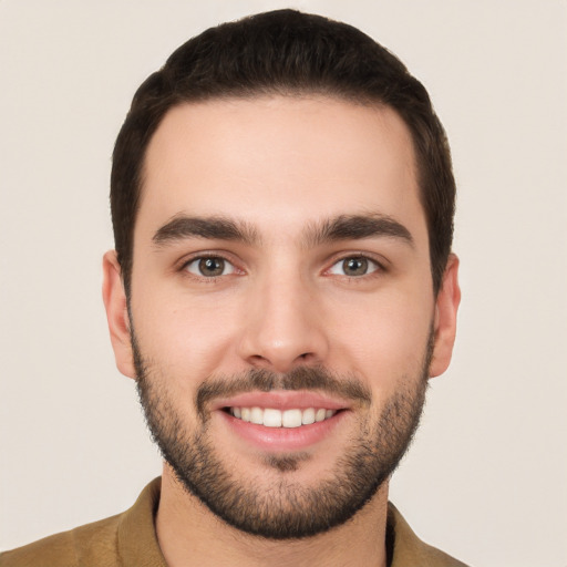 Joyful white young-adult male with short  brown hair and brown eyes