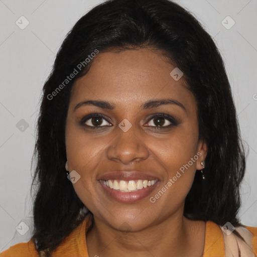 Joyful black young-adult female with long  brown hair and brown eyes
