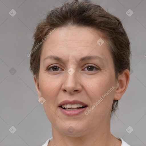 Joyful white adult female with short  brown hair and brown eyes