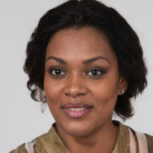 Joyful black young-adult female with medium  brown hair and brown eyes