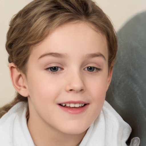 Joyful white child female with short  brown hair and grey eyes