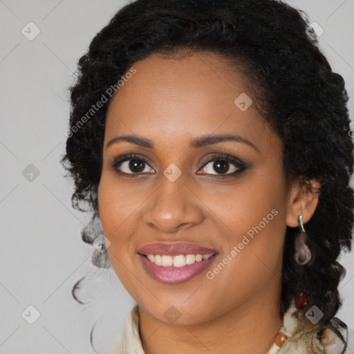 Joyful black young-adult female with long  brown hair and brown eyes