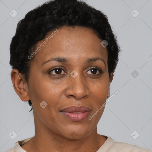 Joyful black adult female with short  brown hair and brown eyes