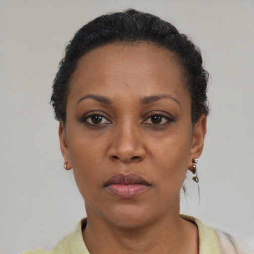Neutral black adult female with short  black hair and brown eyes