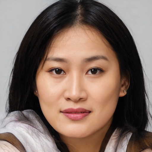 Joyful asian young-adult female with medium  black hair and brown eyes