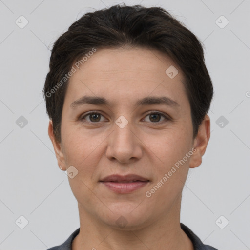 Joyful white adult female with short  brown hair and brown eyes