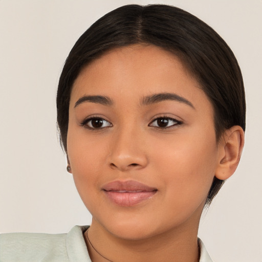 Joyful latino young-adult female with short  brown hair and brown eyes