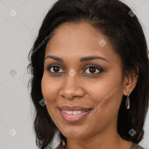 Joyful black young-adult female with long  brown hair and brown eyes