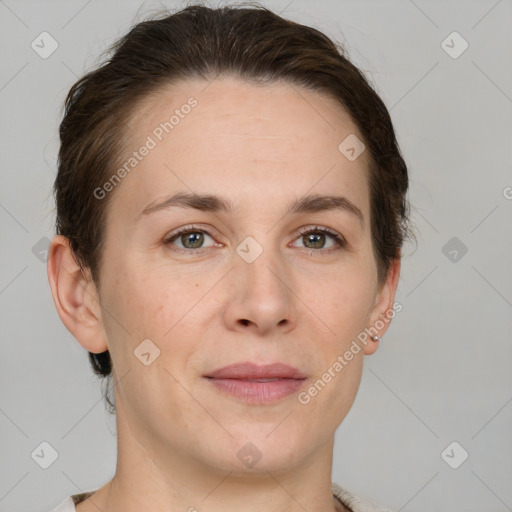 Joyful white adult female with short  brown hair and grey eyes