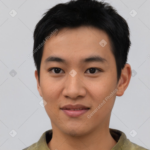 Joyful asian young-adult male with short  black hair and brown eyes