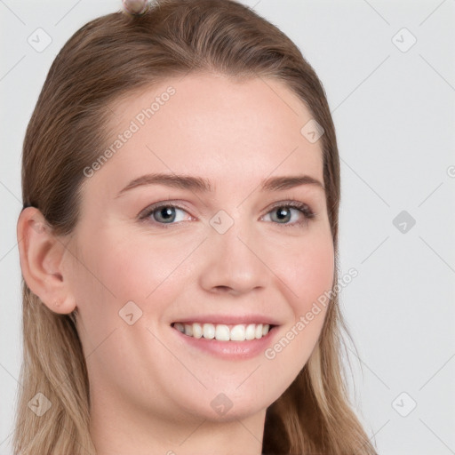 Joyful white young-adult female with long  brown hair and blue eyes