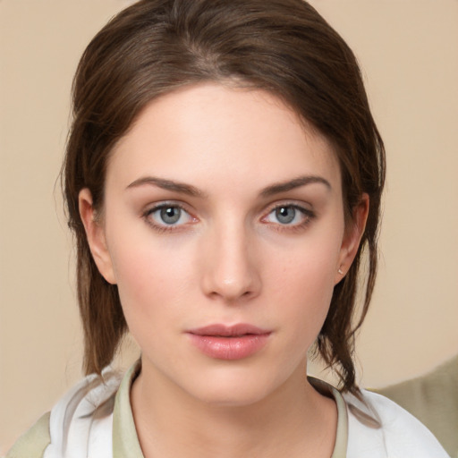 Neutral white young-adult female with medium  brown hair and brown eyes