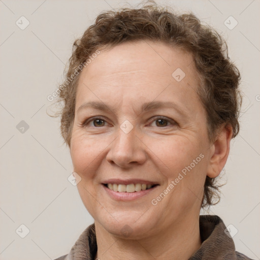 Joyful white adult female with short  brown hair and brown eyes