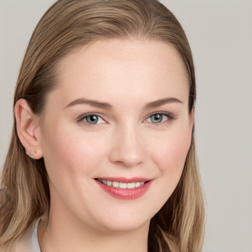 Joyful white young-adult female with long  brown hair and grey eyes