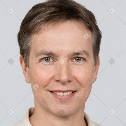 Joyful white adult male with short  brown hair and grey eyes