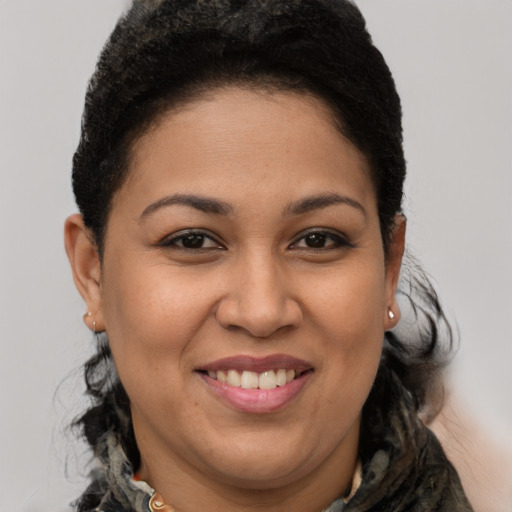 Joyful latino young-adult female with short  brown hair and brown eyes