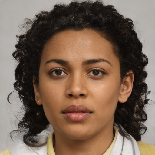 Neutral black young-adult female with medium  brown hair and brown eyes