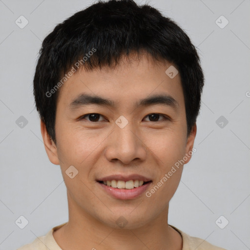 Joyful asian young-adult male with short  brown hair and brown eyes