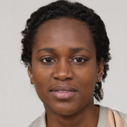 Neutral black young-adult female with short  brown hair and brown eyes
