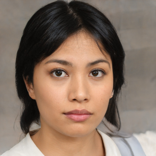 Neutral asian young-adult female with medium  black hair and brown eyes