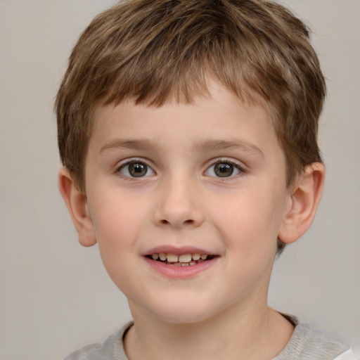 Joyful white child male with short  brown hair and brown eyes