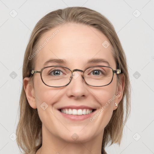 Joyful white adult female with medium  brown hair and blue eyes