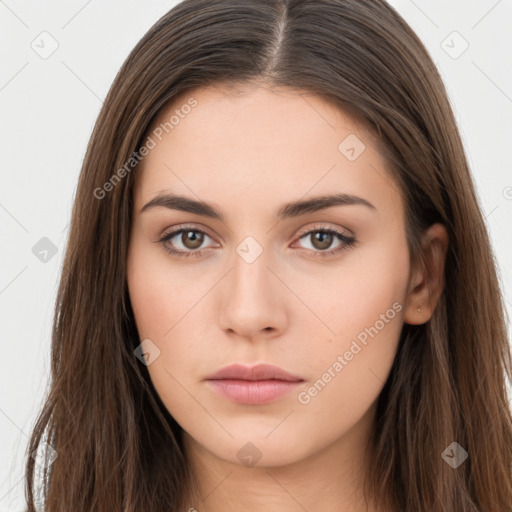 Neutral white young-adult female with long  brown hair and brown eyes