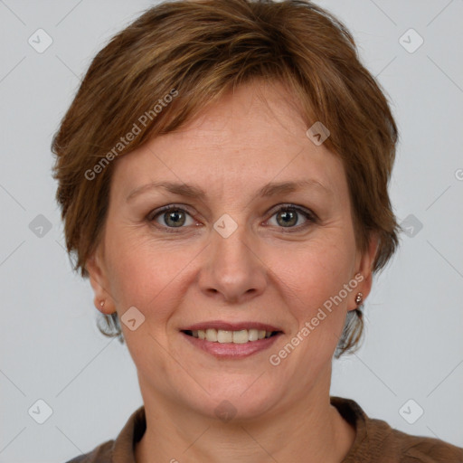 Joyful white adult female with medium  brown hair and grey eyes