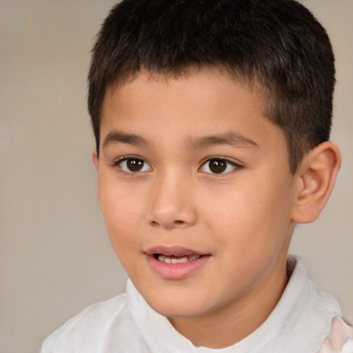 Joyful white child male with short  brown hair and brown eyes