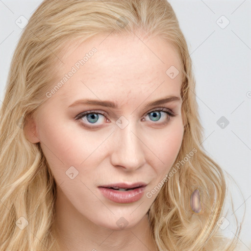 Joyful white young-adult female with long  blond hair and blue eyes