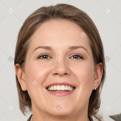 Joyful white adult female with medium  brown hair and grey eyes