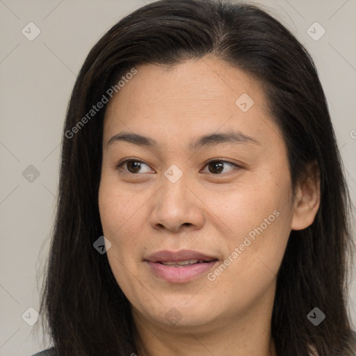 Joyful asian young-adult female with long  brown hair and brown eyes