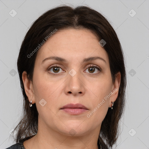 Joyful white adult female with medium  brown hair and brown eyes