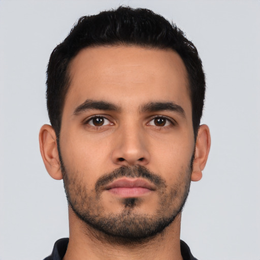 Neutral latino young-adult male with short  black hair and brown eyes