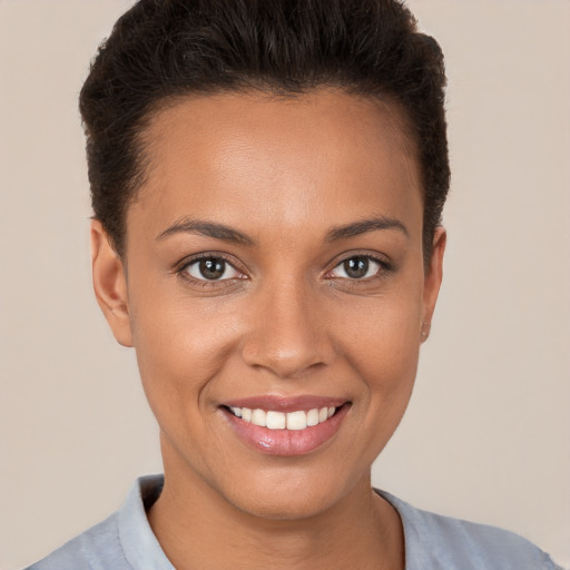 Joyful white young-adult female with short  brown hair and brown eyes