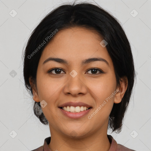 Joyful latino young-adult female with medium  brown hair and brown eyes