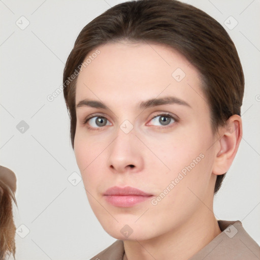 Neutral white young-adult female with short  brown hair and brown eyes