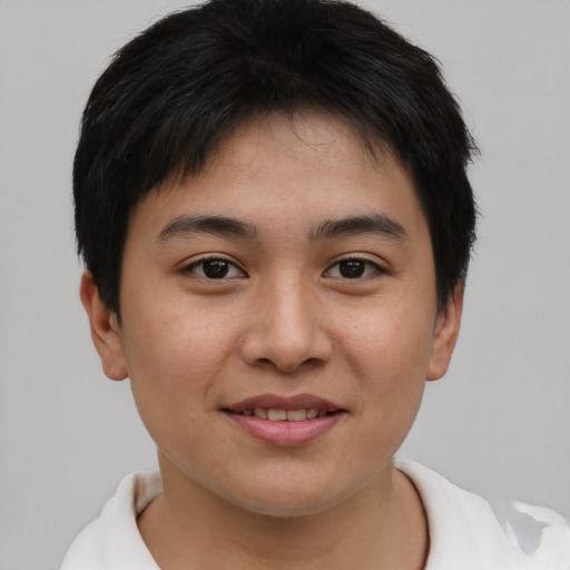Joyful asian young-adult male with short  brown hair and brown eyes