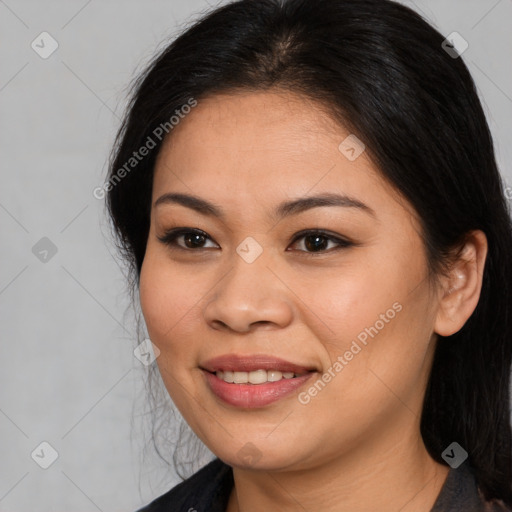 Joyful asian young-adult female with long  brown hair and brown eyes