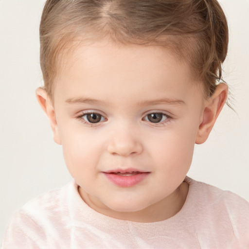 Joyful white child female with short  brown hair and brown eyes